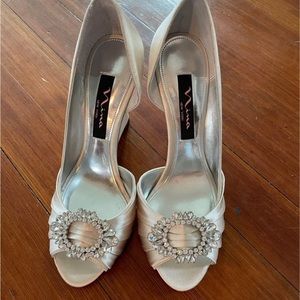 Nina champagne satin wedge heel with jewel detail. Never worn!